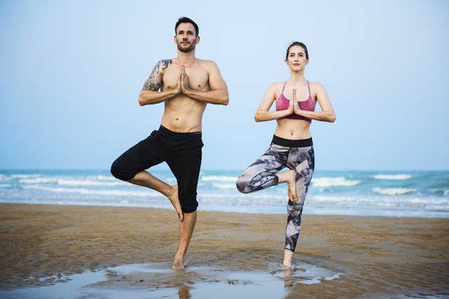 Two people in yoga poses