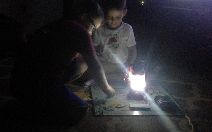 children playing game in dark